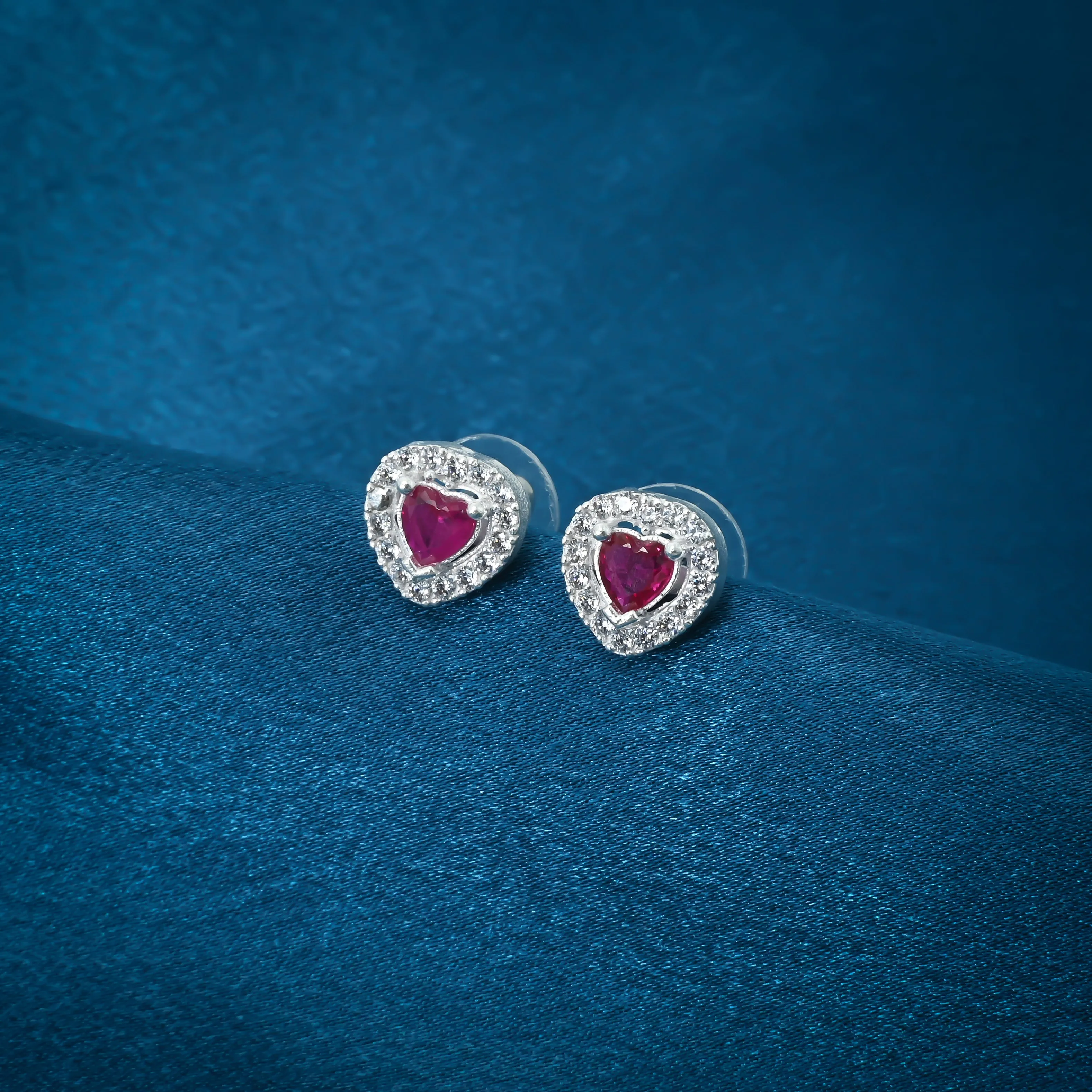 Heart-Shaped Earrings With Pink Gemstones And Smaller Surrounding Gems.
